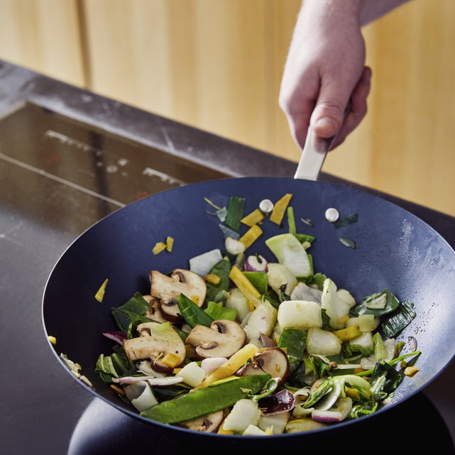 How do you clean a burnt-in wok?